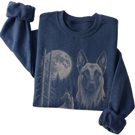 Folded navy crewneck sweatshirt showing the Belgian Malinois Moonlit Forest graphic