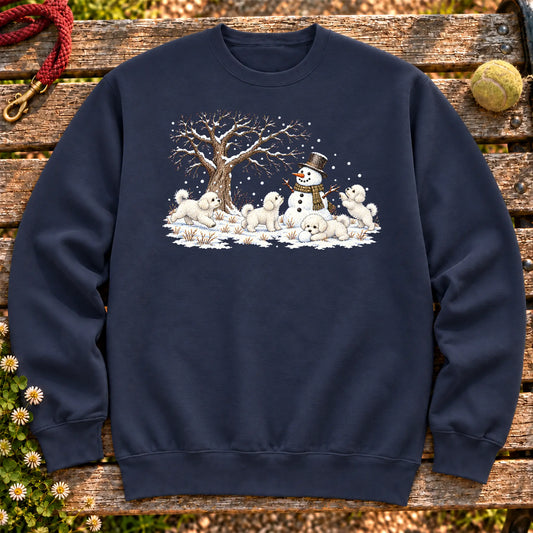 Bichon Frise puppies playing in snow with a snowman on a Navy sweatshirt