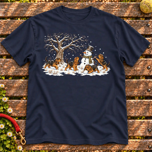 Bloodhound puppies playing in snow with a snowman on a Navy T-shirt