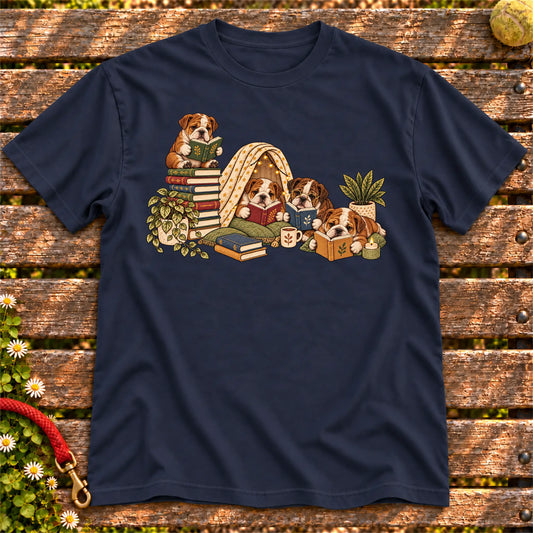 Bulldog puppies reading books in a cozy blanket fort on a Navy T-shirt