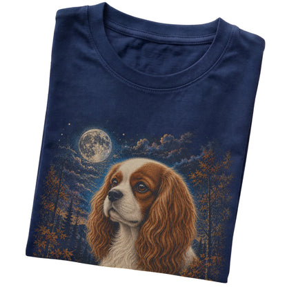 Folded navy T-shirt with Cavalier King Charles Spaniel Autumn Moon artwork.
