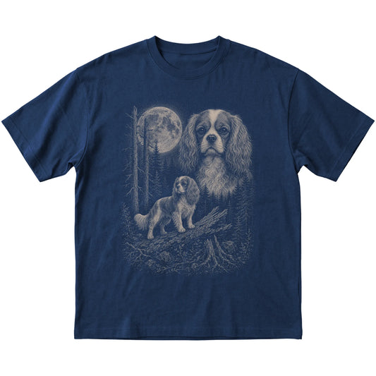 Cavalier King Charles Spaniel Moonlit Forest graphic on a navy Softstyle T-shirt laid flat