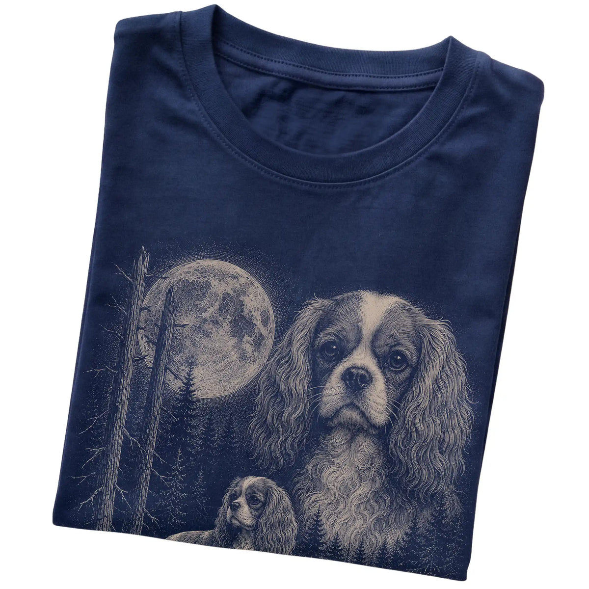 Folded navy Softstyle T-shirt showing the Cavalier King Charles Spaniel Moonlit Forest graphic