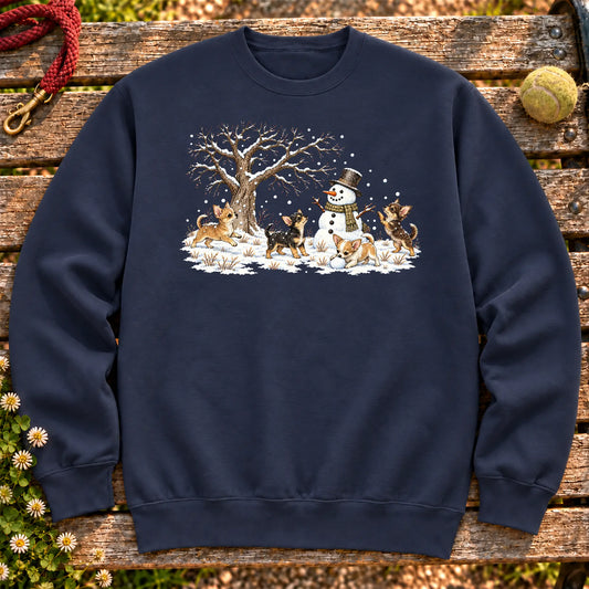 Chihuahua puppies playing in snow with a snowman on a Navy sweatshirt