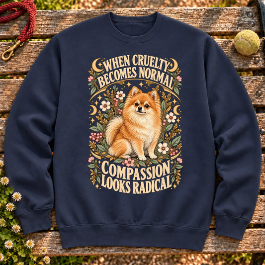 Compassion Looks Radical Pomeranian design on a Navy Gildan sweatshirt