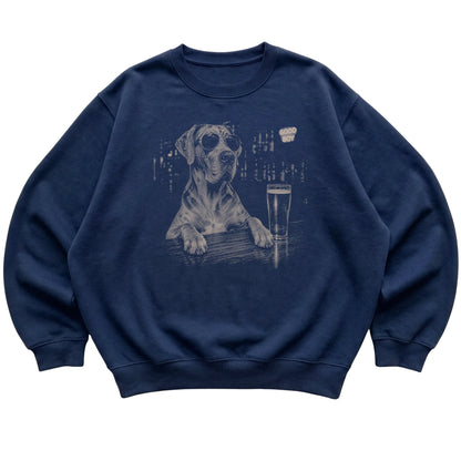 Navy Great Dane at a bar beside a pint, laid flat