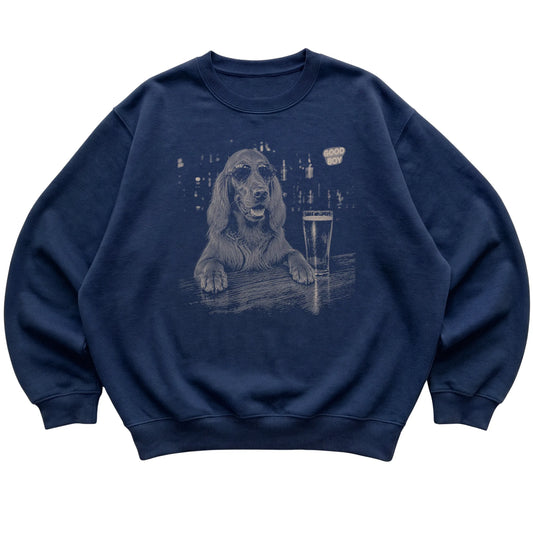 Navy Irish Setter at a bar beside a pint, laid flat