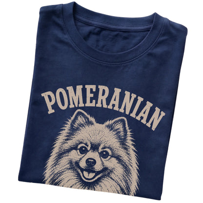 Navy T-shirt featuring Fluffy, Loud & Unbothered - Pomeranian, folded presentation