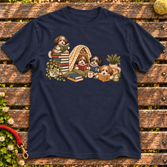 Havanese puppies reading books in a cozy blanket fort on a Navy T-shirt