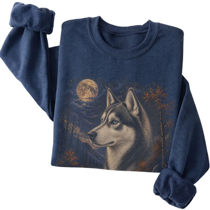 Folded navy sweatshirt with Husky Autumn Moon artwork.