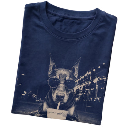 Doberman wearing aviator sunglasses and drinking iced coffee on a Navy Gildan Softstyle T-Shirt, folded view