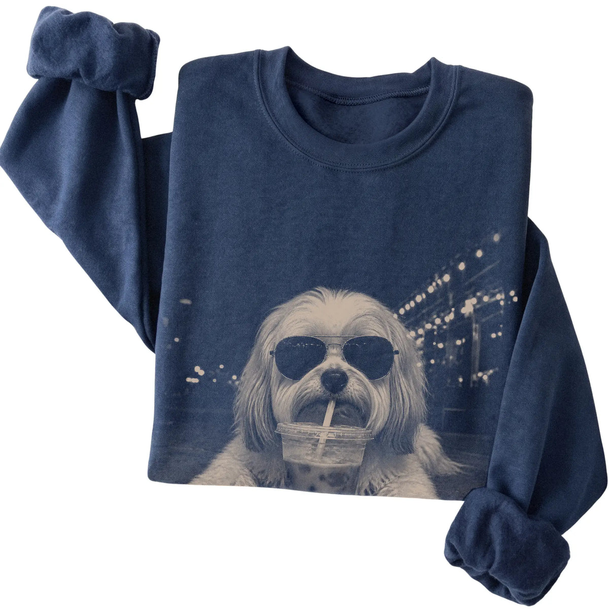 Havanese wearing aviator sunglasses and drinking iced coffee on a Navy Gildan Heavy Blend Crewneck Sweatshirt, folded view
