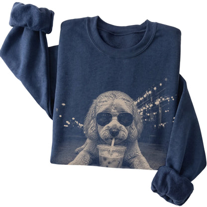 Labradoodle wearing aviator sunglasses and drinking iced coffee on a Navy Gildan Heavy Blend Crewneck Sweatshirt, folded view