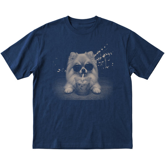 Pomeranian wearing aviator sunglasses and drinking iced coffee on a Navy Gildan Softstyle T-Shirt, flat lay view
