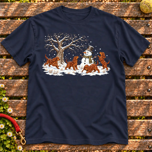 Irish Setter puppies playing in snow with a snowman on a Navy T-shirt