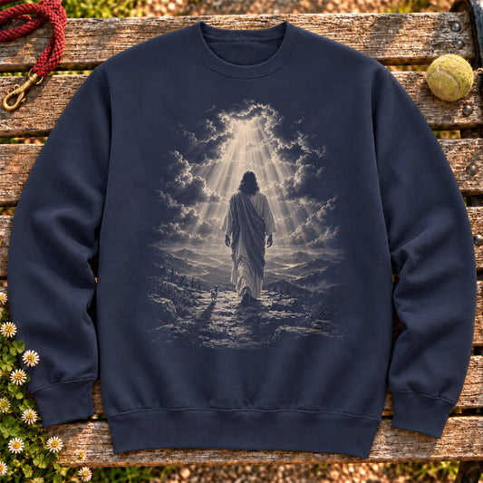 Navy crewneck sweatshirt showing Jesus walking beside a Chihuahua beneath rays of light