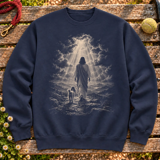 Navy crewneck sweatshirt showing Jesus walking beside a Miniature Poodle beneath rays of light