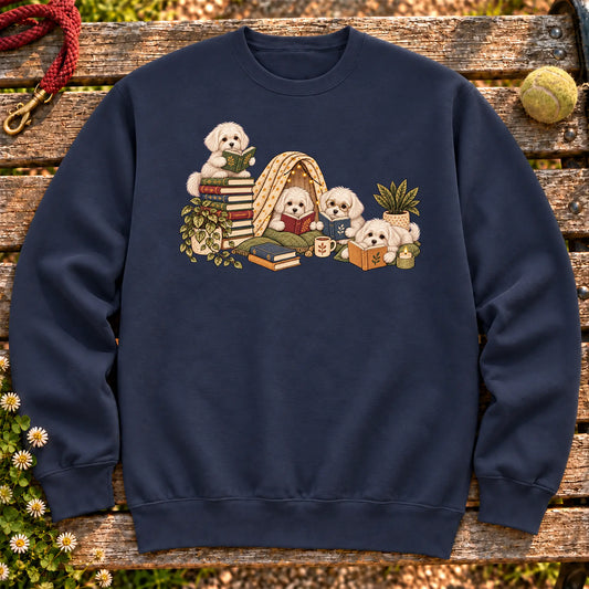 Maltese puppies reading books in a cozy blanket fort on a Navy sweatshirt