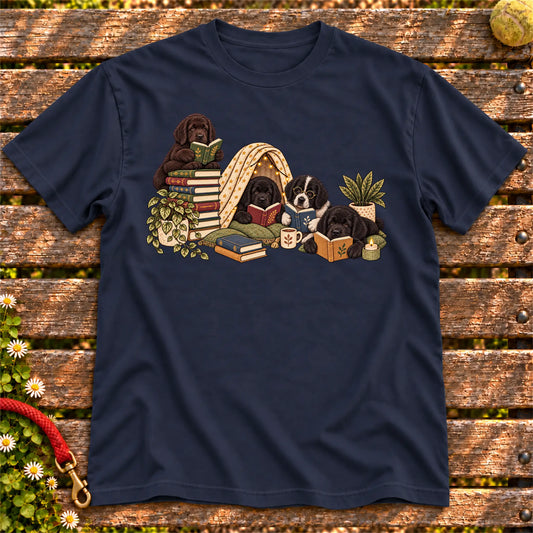 Newfie puppies reading books in a cozy blanket fort on a Navy T-shirt