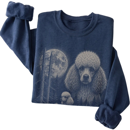 Folded navy crewneck sweatshirt showing the Poodle Moonlit Forest graphic
