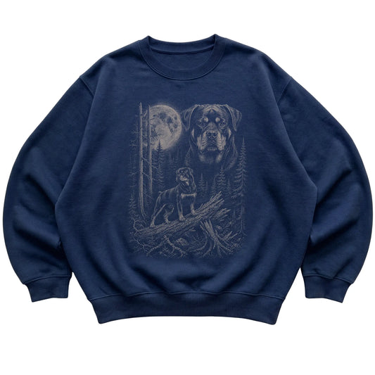 Rottweiler Moonlit Forest graphic on a navy crewneck sweatshirt laid flat
