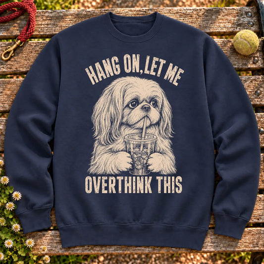 Shih Tzu Iced Coffee Overthink on a Navy crewneck sweatshirt, shown flat