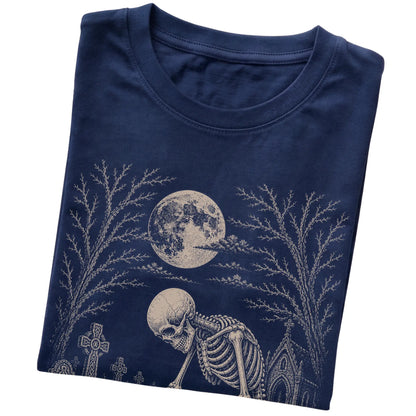 Folded Navy T-shirt with a skeleton petting a Pug in a graveyard