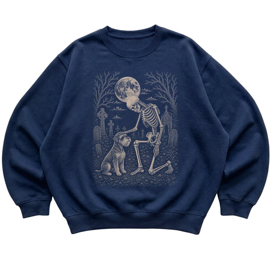 Skeleton petting a Schnauzer in a graveyard on a Navy sweatshirt