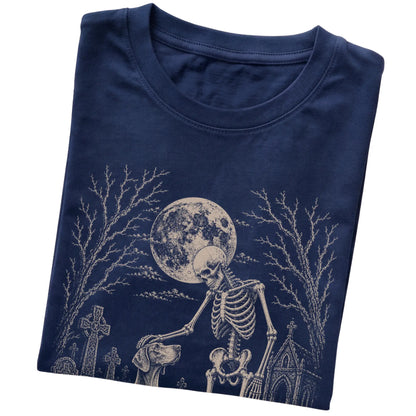Folded Navy T-shirt with a skeleton petting a Weimaraner in a graveyard