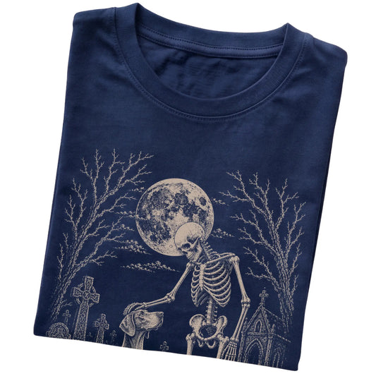 Folded Navy T-shirt with a skeleton petting a Weimaraner in a graveyard
