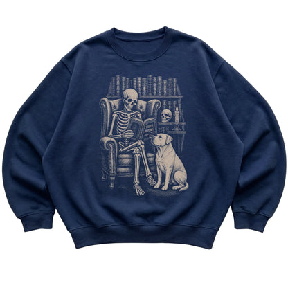 Skeleton reading Tales Beyond to an American Bulldog on a Navy sweatshirt