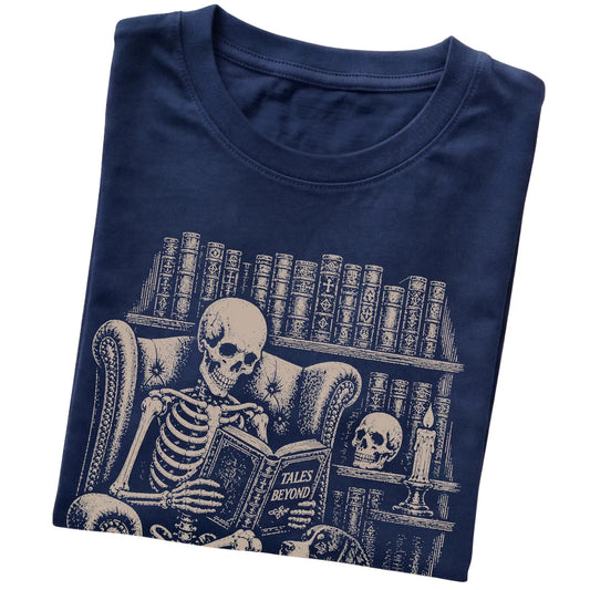 Folded Navy T-shirt with a skeleton reading Tales Beyond to a Bernese Mountain Dog