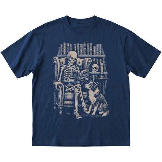 Skeleton reading Tales Beyond to a Border Collie on a Navy T-shirt