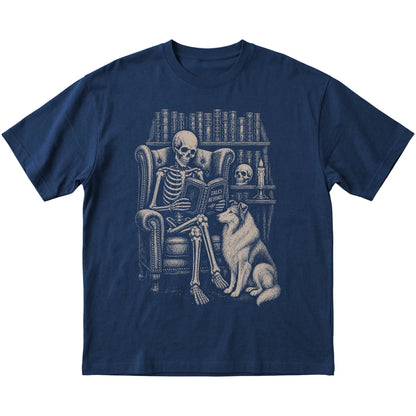 Skeleton reading Tales Beyond to a Collie on a Navy T-shirt
