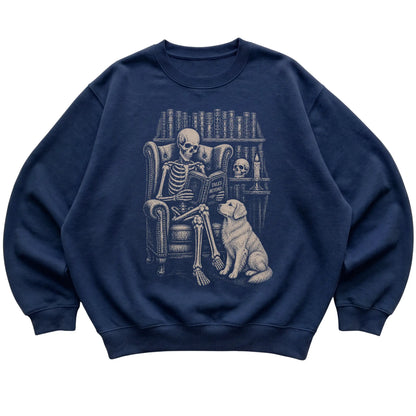 Skeleton reading Tales Beyond to a Golden Retriever on a Navy sweatshirt