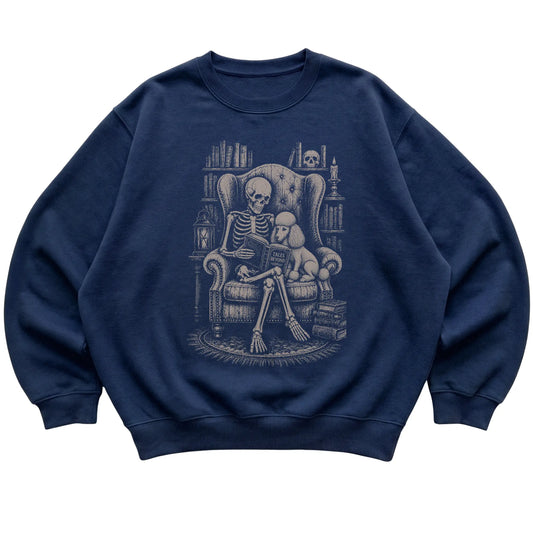 Skeleton reading Tales Beyond to a Poodle on a Navy sweatshirt