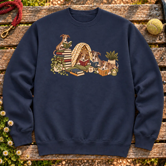 Whippet puppies reading books in a cozy blanket fort on a Navy sweatshirt