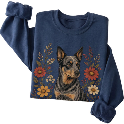 Navy crewneck sweatshirt with Blue Heeler portrait and wildflowers, folded view