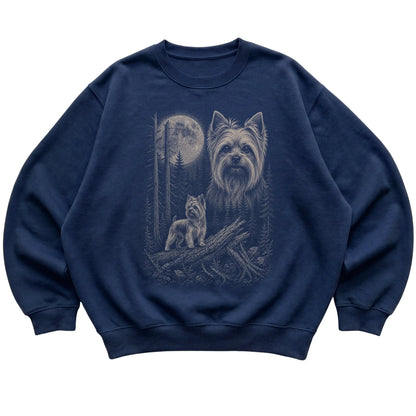 Yorkie Moonlit Forest graphic on a navy crewneck sweatshirt laid flat