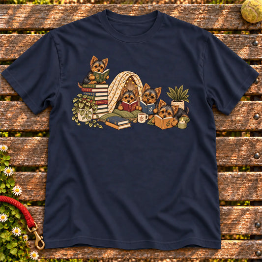 Yorkie puppies reading books in a cozy blanket fort on a Navy T-shirt