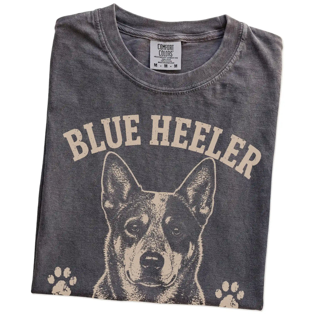 Folded Pepper Comfort Colors® T-shirt showing Blue Heeler design with “Always Working, Even When I'm Not” lettering