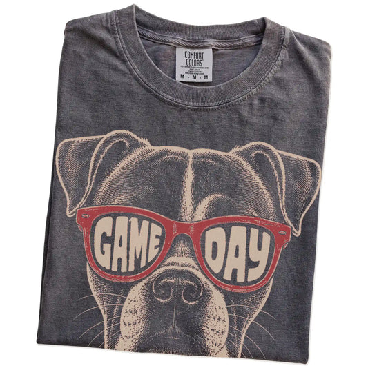 Folded Pepper Comfort Colors® T-shirt showing american bulldog wearing red game day sunglasses