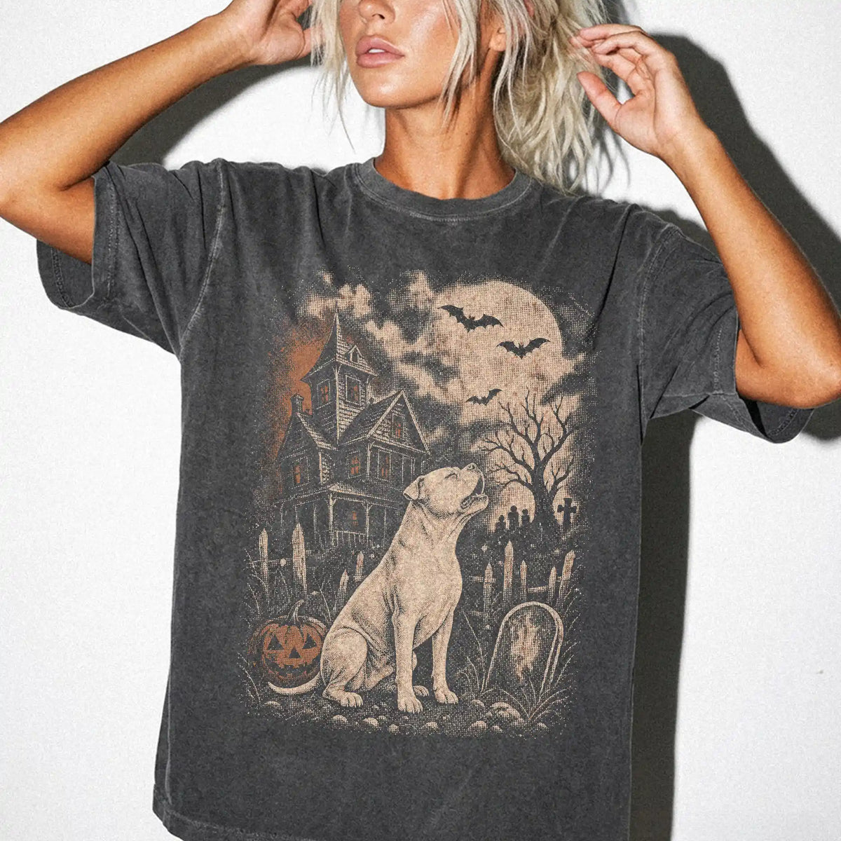 Model wearing a Pepper Comfort Colors® T-shirt showing American Bulldog in a vintage haunted-house scene