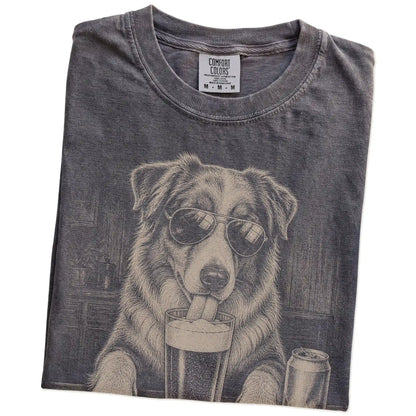 Folded Pepper Comfort Colors® t-shirt showing Australian Shepherd sneaking a drink from a pint