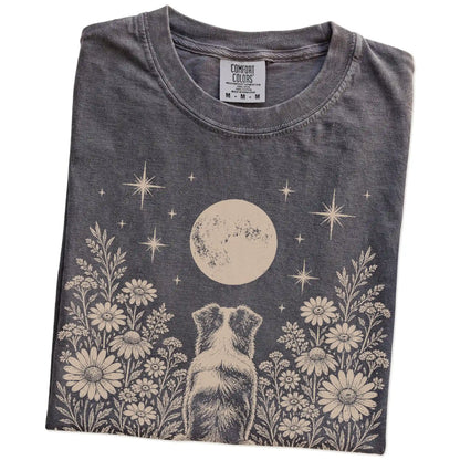 Folded Pepper Comfort Colors® T-shirt showing Australian Shepherd beneath a wildflower moon