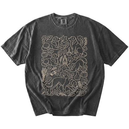 Bernese Mountain Dog dogs with pumpkins, leaves, acorns, and woodland details on a Pepper Comfort Colors® T-shirt