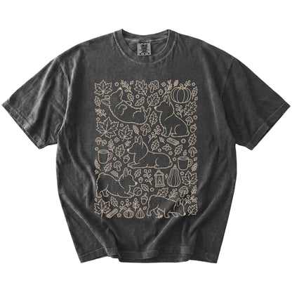Corgi dogs with pumpkins, leaves, acorns, and woodland details on a Pepper Comfort Colors® T-shirt
