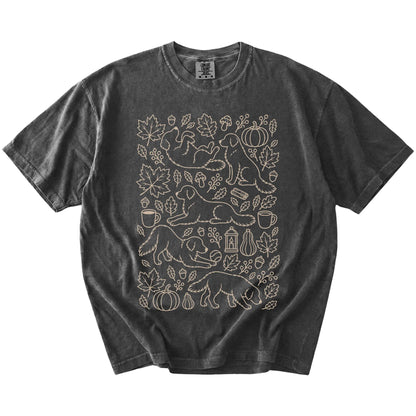 Golden Retriever dogs with pumpkins, leaves, acorns, and woodland details on a Pepper Comfort Colors® T-shirt