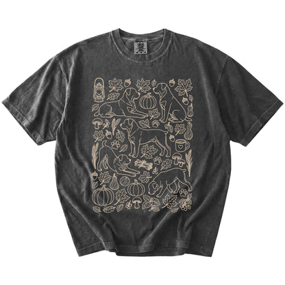 Rottweiler dogs with pumpkins, leaves, acorns, and woodland details on a Pepper Comfort Colors® T-shirt
