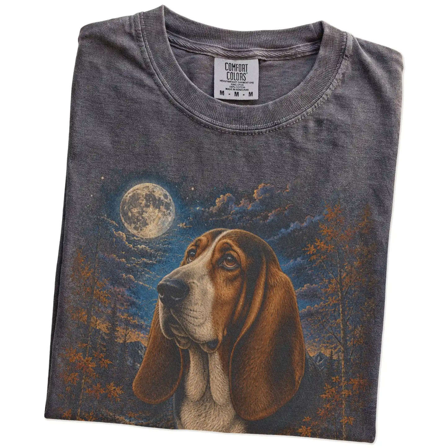 Folded Pepper Comfort Colors® t-shirt showing Basset Hound in a fall forest graphic
